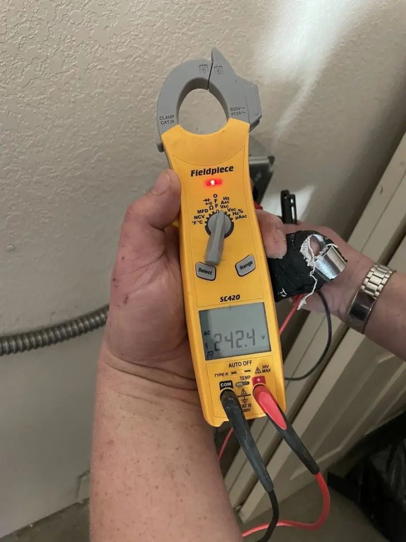 Voltage testing with clamp meter during Electrical Installation Services in Morton Grove